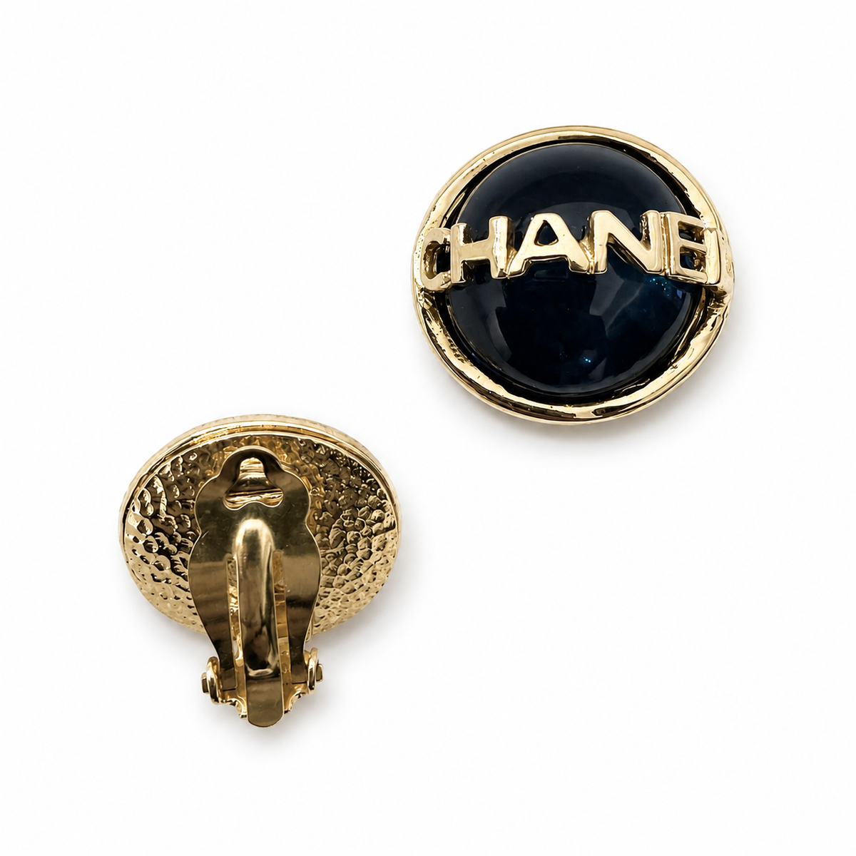 Chanel round clip-on earrings in black enamel/resin with gold-tone CHANEL lettering