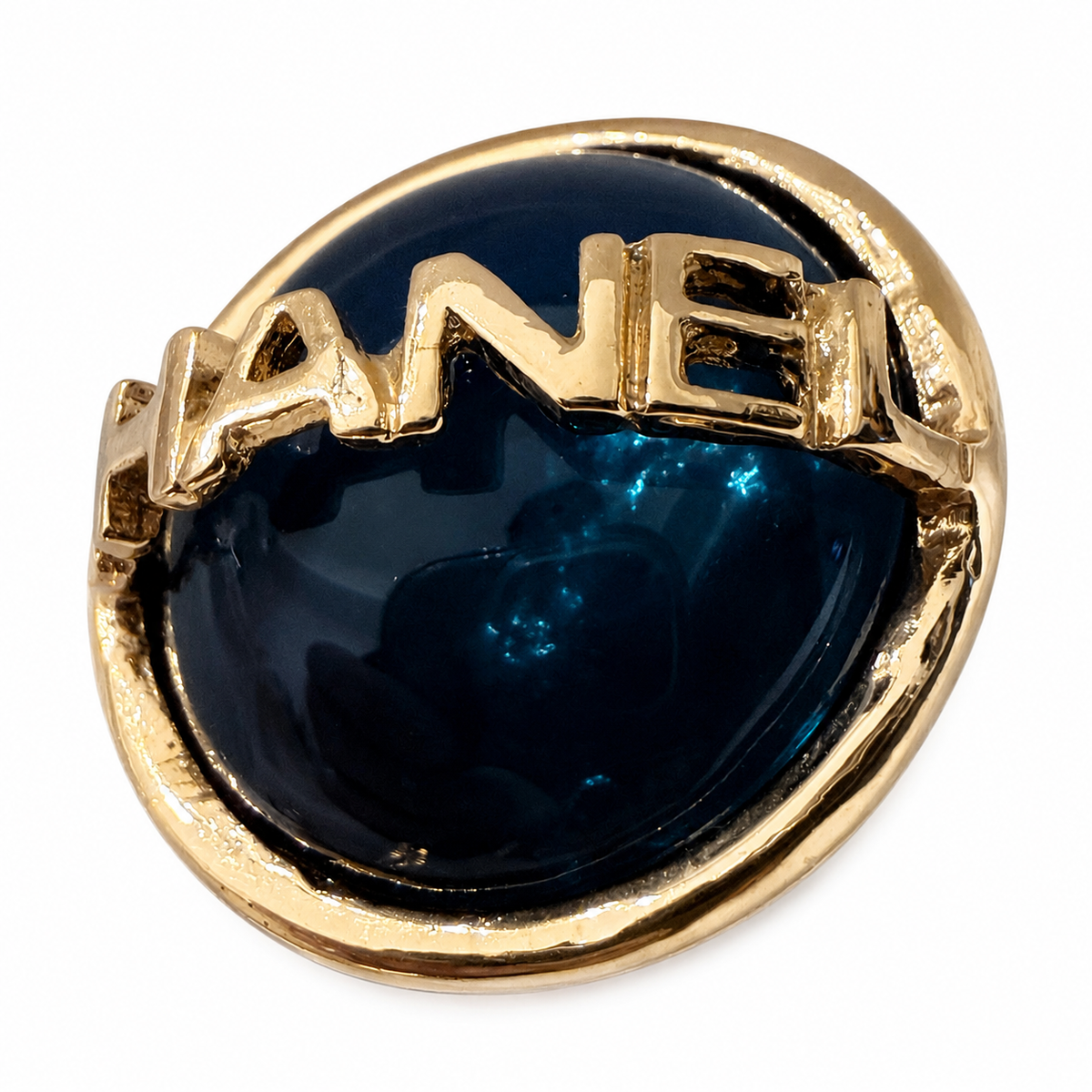 Chanel round clip-on earrings in black enamel/resin with gold-tone CHANEL lettering